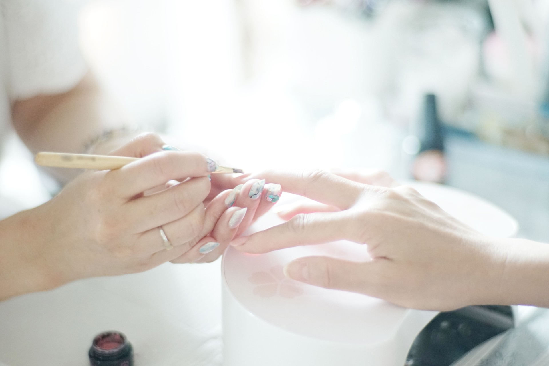 Woman receiving a manicure in a nail salon